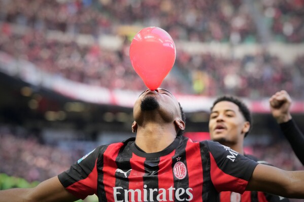 AC Milan's Christopher Nkunku celebrates after scoring his side's second goal from a penalty kick during a Serie A soccer match between AC Milan and Hellas Verona, in Milan, Italy, Dec. 28, 2025. (AP Photo/Luca Bruno, File)