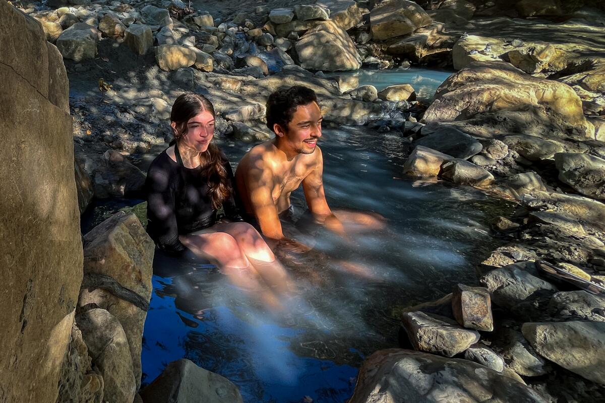 Hikers Evelyn Torres and Emanuel Leon soak at Montecito Hot Springs.