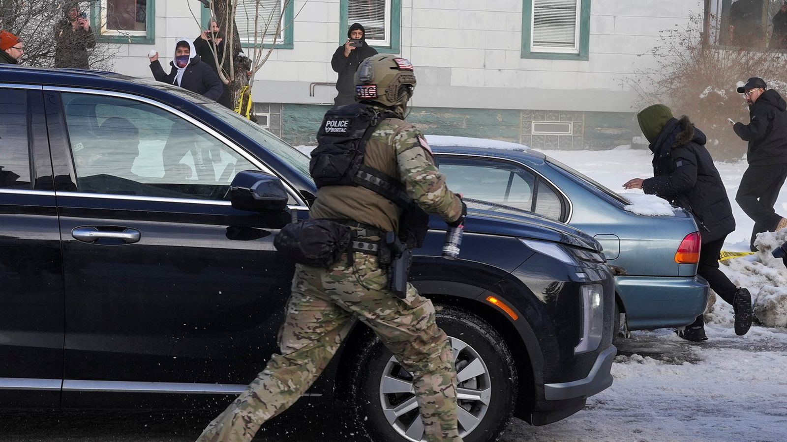 Protesters tried to block vehicles from leaving the scene after a driver of a vehicle was shot. Pic Reuters.