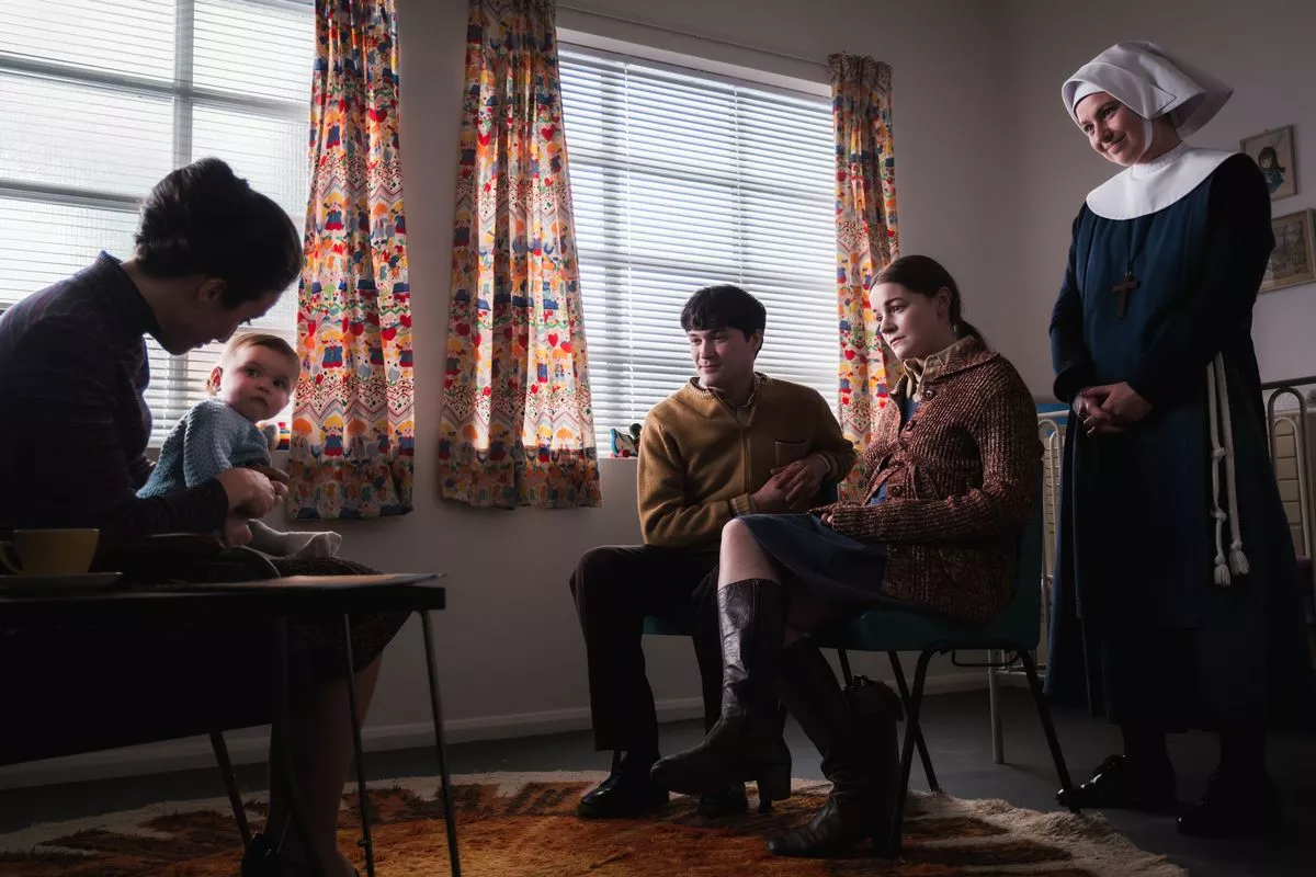 Call the Midwife's Bernice holding a baby