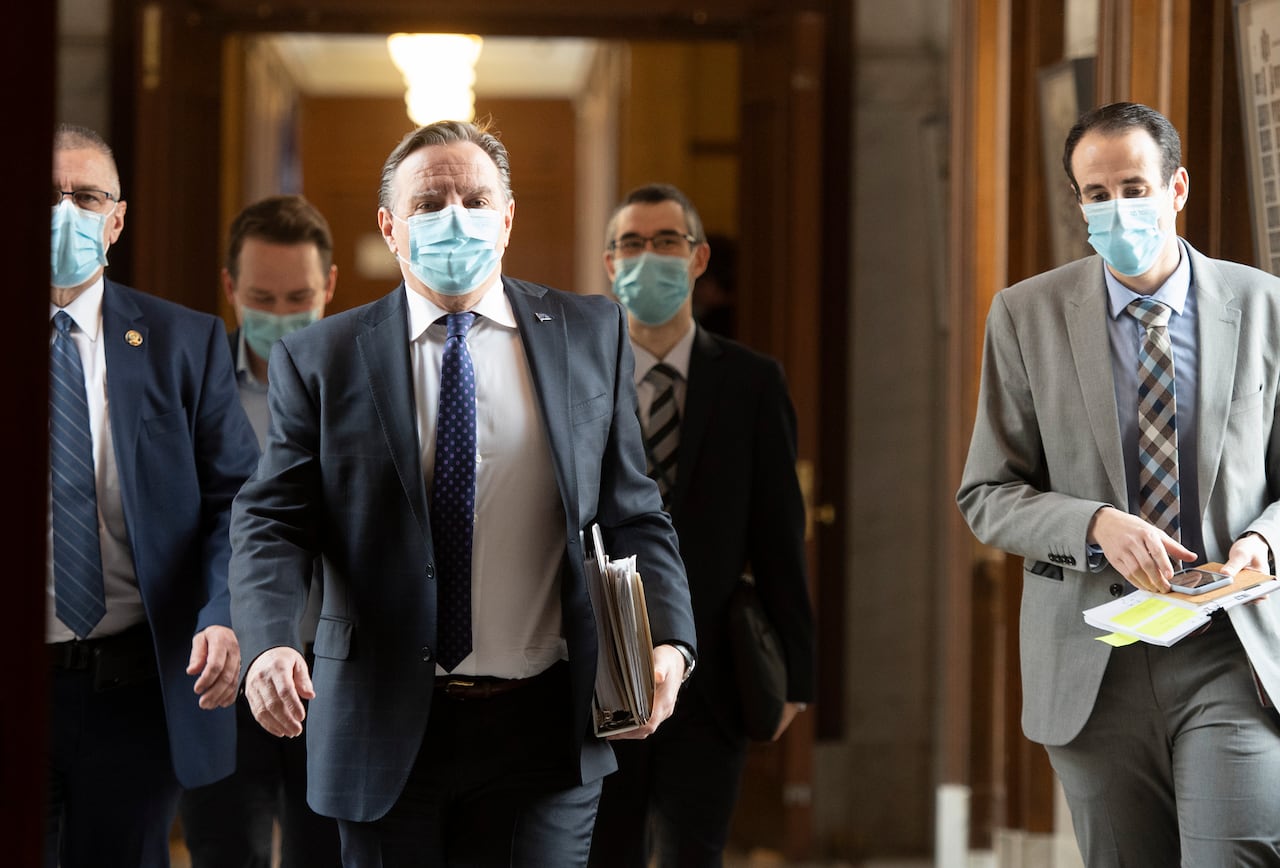 men walking wearing medical masks 