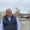 Chris Mikkelsen, executive director of the Humboldt Bay Harbor District, stands on the site of a planned marine terminal in Eureka, Calif. that will assemble wind turbines. The Trump administration recently canceled more than $426 million in federal grants for the port.