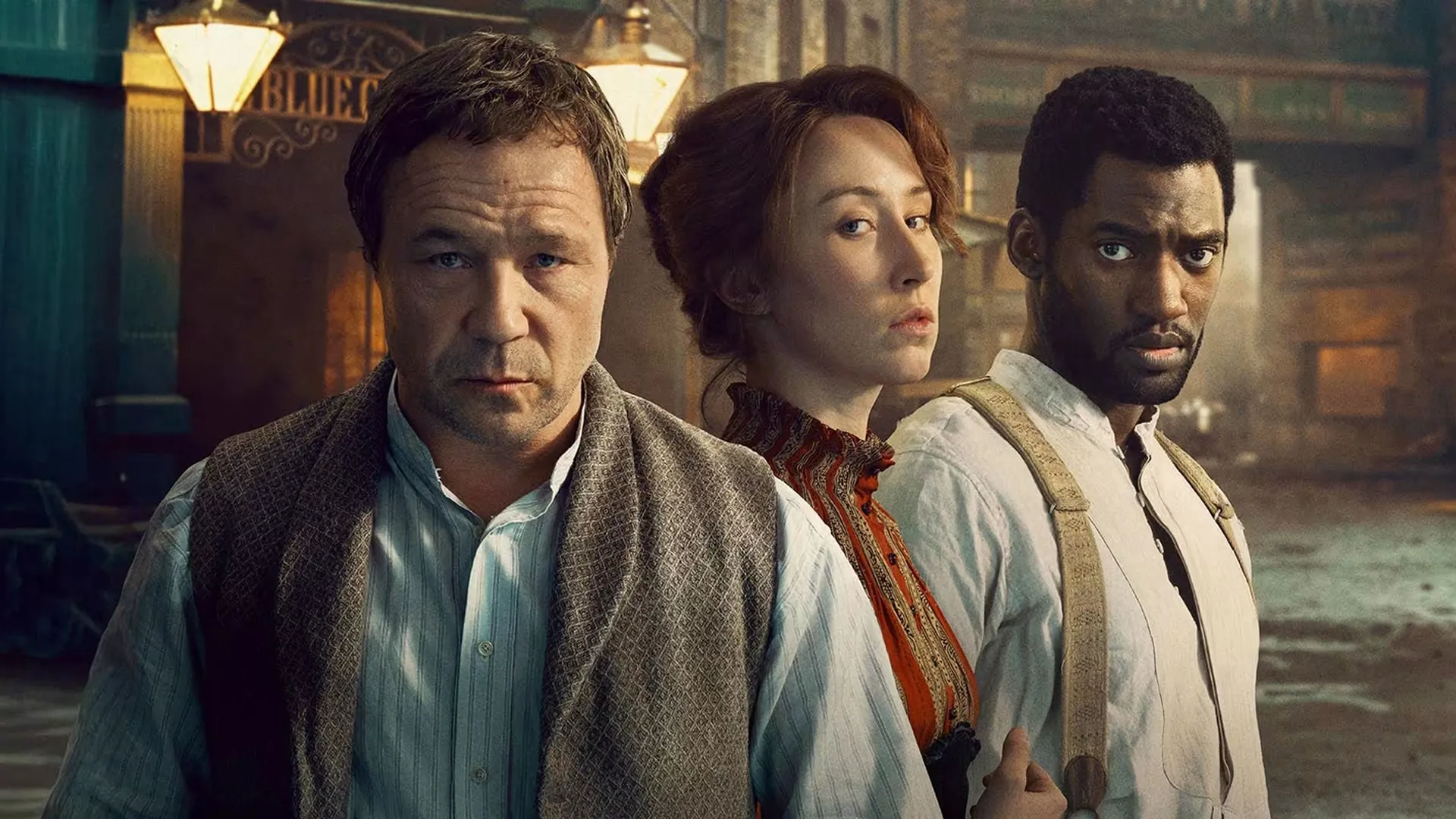 This image features the main cast of the historical drama series A Thousand Blows. The individuals pictured are, from left to right: Stephen Graham, Erin Doherty, and Malachi Kirby. 