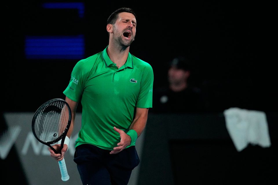 Novak Djokovic of Serbia reacts during his third round match against Botic van de Zandschulp of the Netherlands at the Australian Open tennis championship in Melbourne, Australia, Saturday, Jan. 24, 2026. (AP Photo/Dita Alangkara)