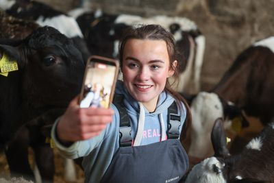 ‘I can go from being covered in cow dung to glam’ – Meet the 23-year-old TikTok star who quit her job to become a full-time dairy farmer