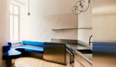 A Curvy Blue Banquette Solves a Tiny Berlin Apartment’s Puzzling Shape