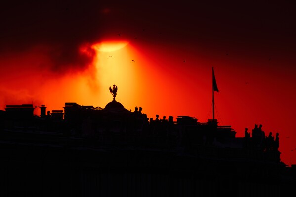 The sun sets behind the State Hermitage Museum in St. Petersburg, Russia, Saturday, Jan. 24, 2026. (AP Photo/Dmitri Lovetsky, File)