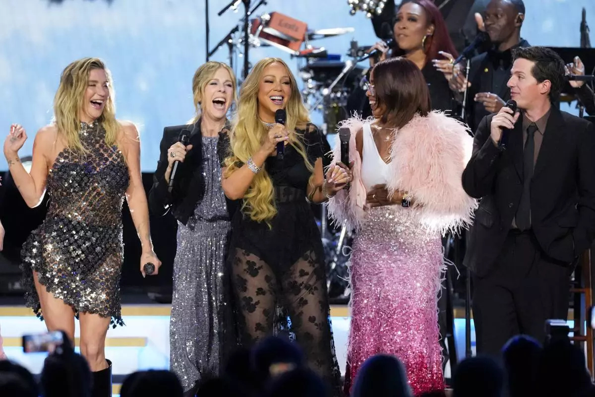 Kesha, from left, R/ita Wilson, Mariah Carey, Gayle King, and Charlie Puth perform during MusiCares Person of the Year honoring Mariah Carey on Friday, Jan. 30, 2026, in Los Angeles. (AP Photo/Chris Pizzello)
