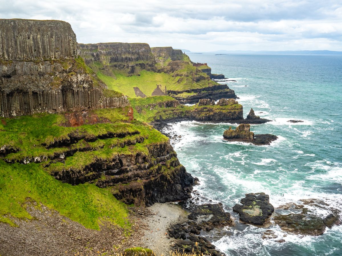 A view of the cliffs from Hamilton's Seat, on top of the cliffs at Benbane Head, in County Antrim, Northern Ireland, on July 5, 2024. 