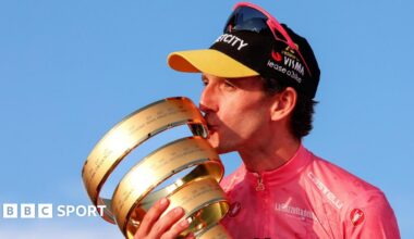 Simon Yates with the Giro d'Italia trophy in 2025
