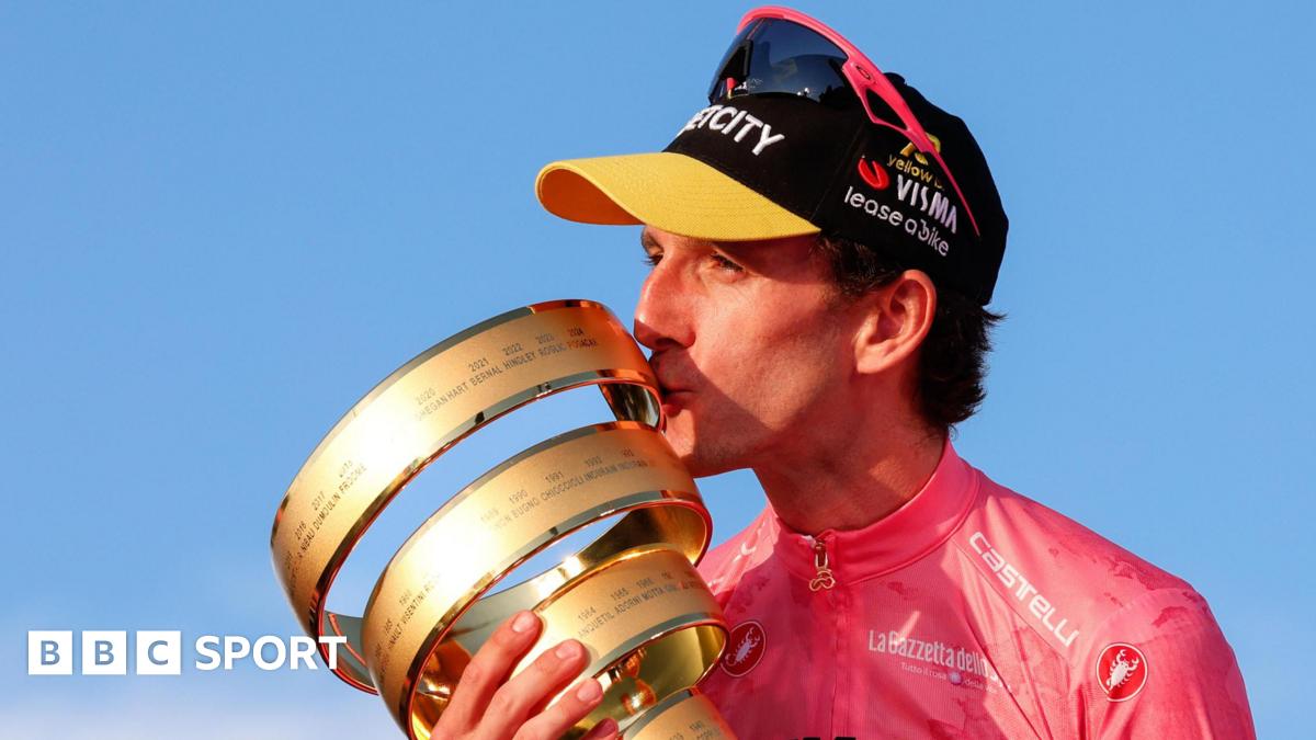 Simon Yates with the Giro d'Italia trophy in 2025