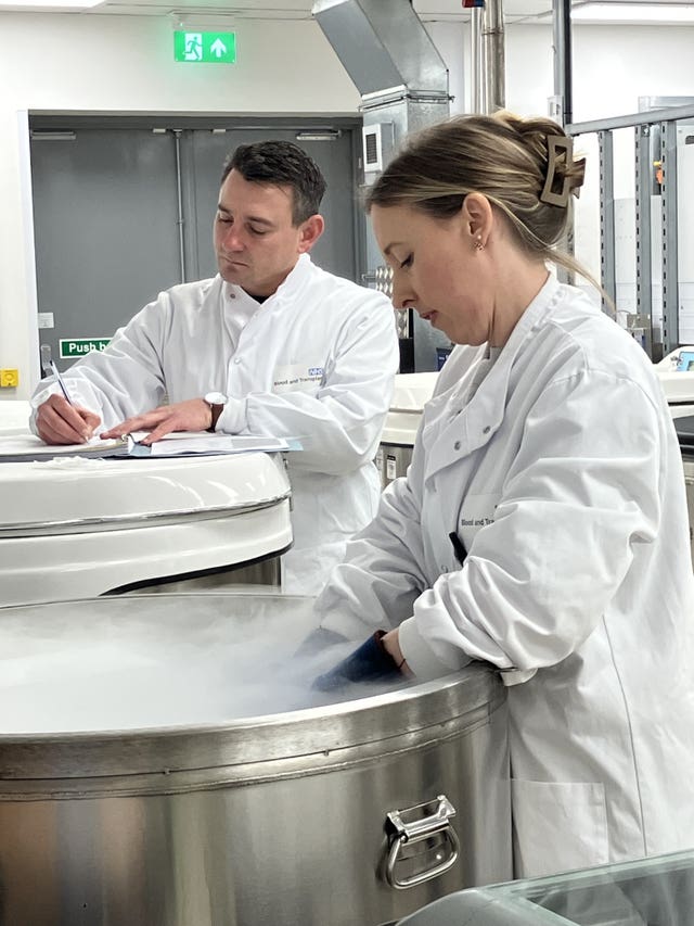 The 1000th cord blood unit being removed from frozen storage and being prepared