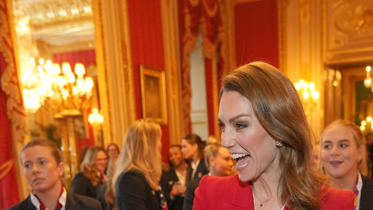Lady in red! The Princess of Wales looks sensational in a scarlet suit for Windsor Castle reception