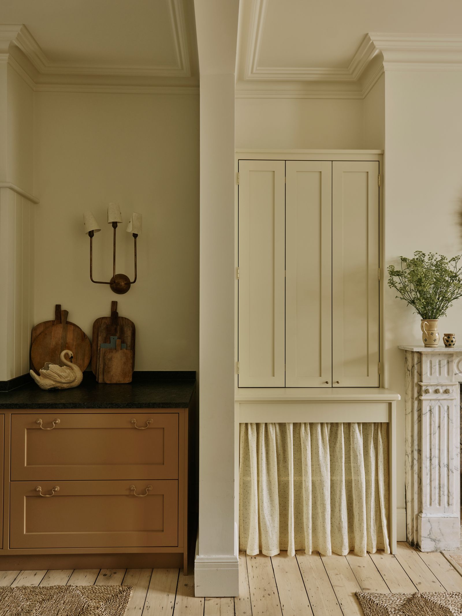 Image may contain Indoors Interior Design Corner Furniture Home Decor Rug Plant Closet and Cupboard