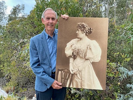 Inspiring life: Dr Bob Brown holding a photo of soprano Amy Sherwin.