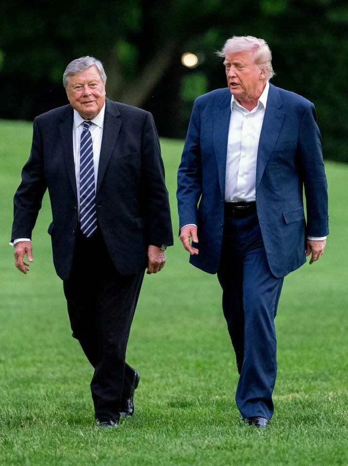 Viktor Knavs and Donald Trump walk on the South Lawn of the White House on May 4, 2025. Chris Kleponis/CNP/Bloomberg via Getty