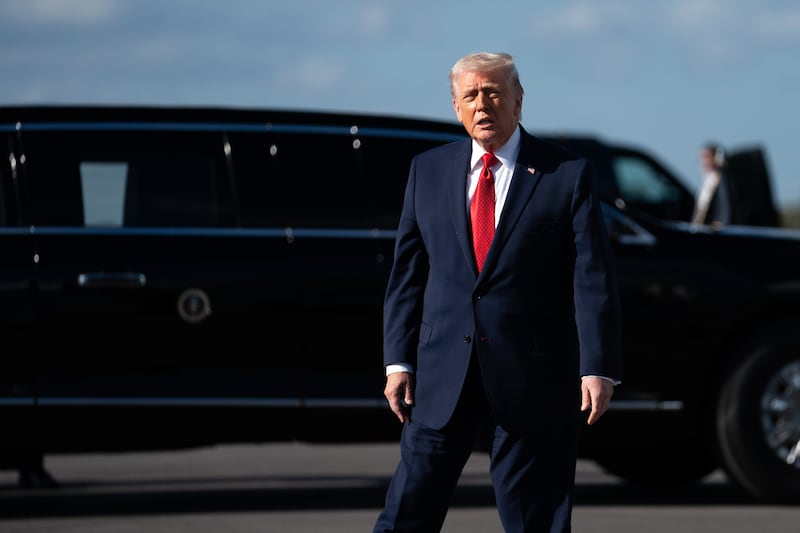 US president Donald Trump arrives at Palm Beach International Airport in Florida on Friday. Photograph: Allison Robbert/The New York Times
                      