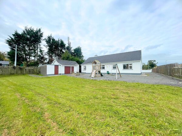 Externally, there is a detached garage with adjoining boiler house and fuel store.