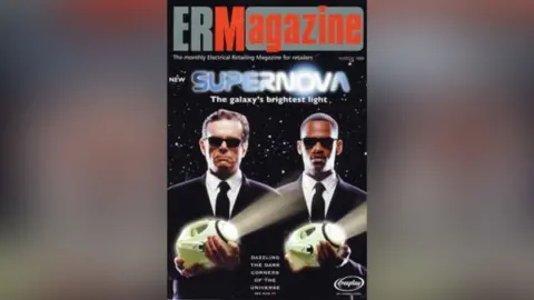 Shad Ellis Two men in black suits and sunglasses pose on the cover of ERM Magazine holding large green torches