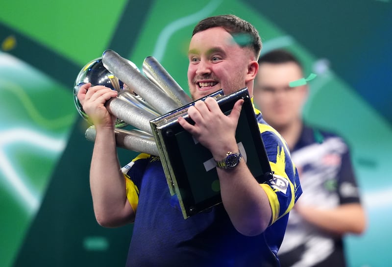 Luke Littler with the Sid Waddell trophy after defeating Gian van Veen on Saturday. Photograph: John Walton/PA Wire