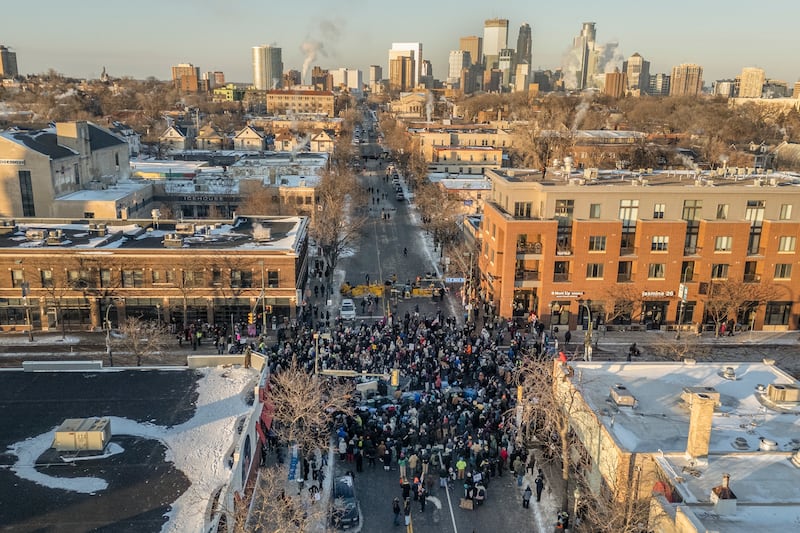 Protesters gather near the site in Minneapolis where Alex Pretti was shot and killed by federal immigration agents earlier this month. Photograph: David Guttenfelder/The New York Times
                      