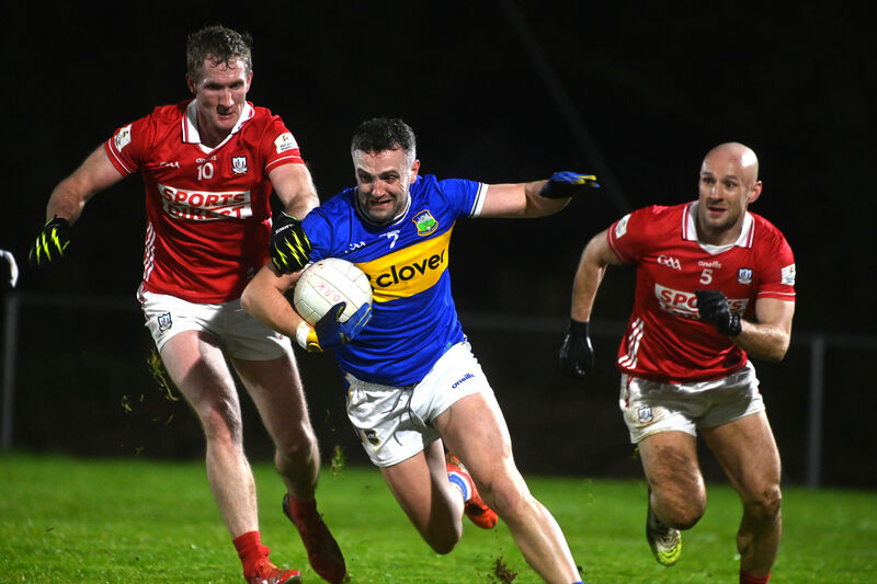  Ruairi Deane of Cork keeps the pressure on Luke Boland of Tipperary. Picture: Larry Cummins