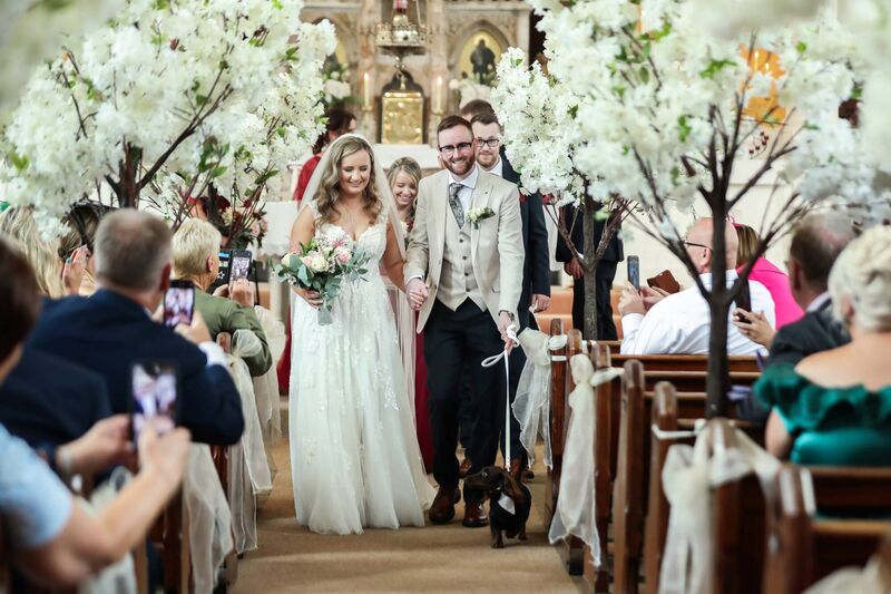 Megan and Paul’s mini Dachshund served as ring bearer on the day.