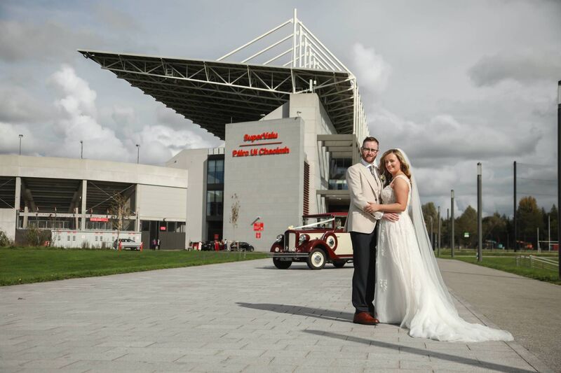 The couple pictured outside Supervalu Páirc Uí Chaoimh on their wedding day. 