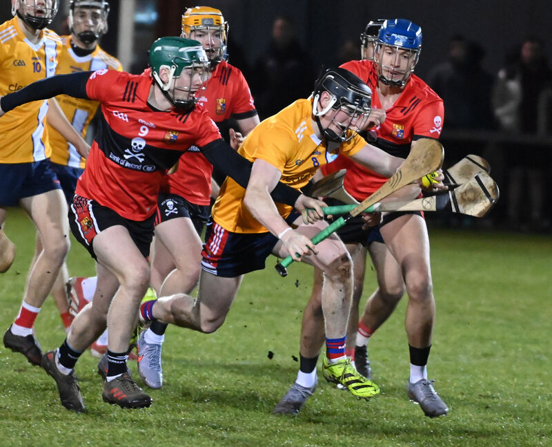 MTU's Joe Egan breaks from UCC's Colin Walsh and Darragh Stakelum. Picture: Eddie O'Hare