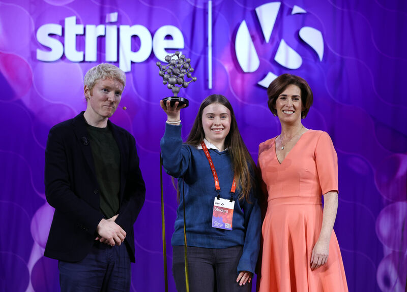 Stripe co-founder and former Young Scientist winner Patrick Collison and education minister Hildegarde Naughton congratulate overall winner Aoibheann Daly from Mercy Mounthawk Secondary School in Tralee at the Stripe Young Scientist Exhibition in the RDS. Picture: Leah Farrell/RollingNews