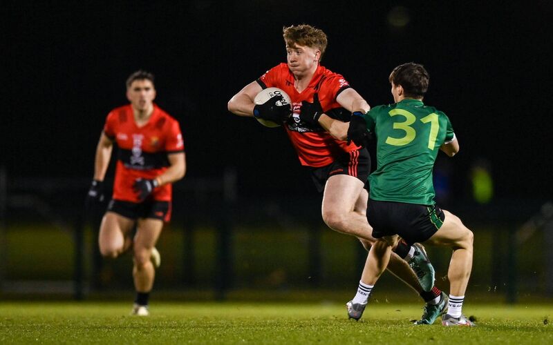 James Horgan of UCC in action against Joe Corrigan of Queen's University Belfast. Picture: Tyler Miller/Sportsfile