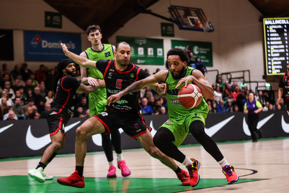Ballincollig's Joshua Steel challenges Jordan Perkins of Garvey's Tralee Warriors. Picture: INPHO/Tom Maher