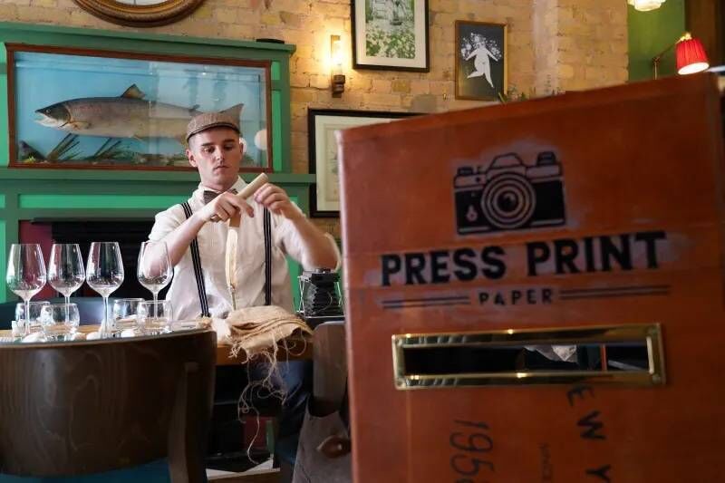 The Apprentice contender Conor Galvin from Glengarriff in West Cork runs Press Print Paper, which produces bespoke 'vintage-style newspaper prints' at events such as weddings and sporting occasions. Picture: WeddingsOnline.ie