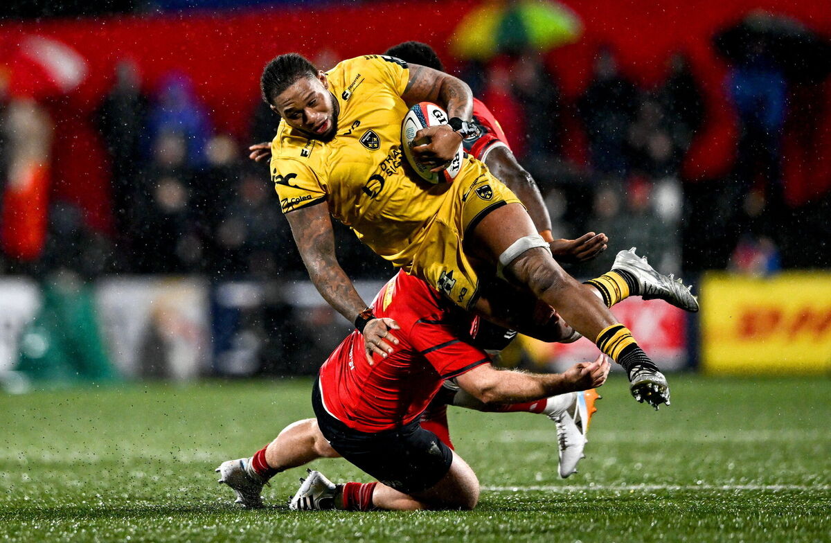 Levi Douglas of Dragons is tackled by Jeremy Loughman of Munster. Picture: Ben McShane/Sportsfile
