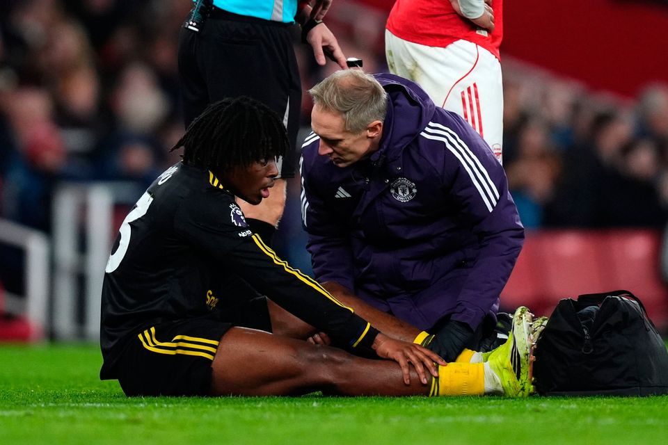 Manchester United's Patrick Dorgu receives treatment for a hamstring injury at the Emirates Stadium on Sunday. Photo: Mike Egerton/PA Wire