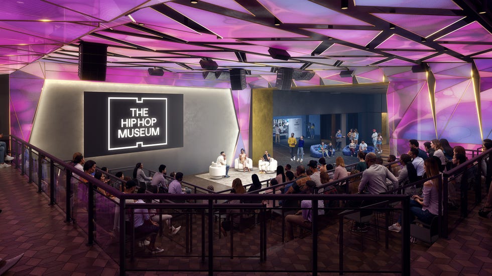Interior view of a modern event space featuring a panel discussion. Interior view of a modern event space featuring a panel discussion.