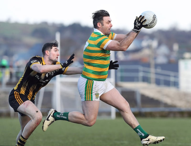 Eoin 'Skinner' Bradley claims the ball ahead of Timmy Gibbons of Strokestown during the All-Ireland Club Intermediate Football Championship semi-final played at Ballyshannon on Saturday 3rd of January 2025