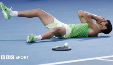 Carlos Alcaraz falls to the floor after beating Alexander Zverev