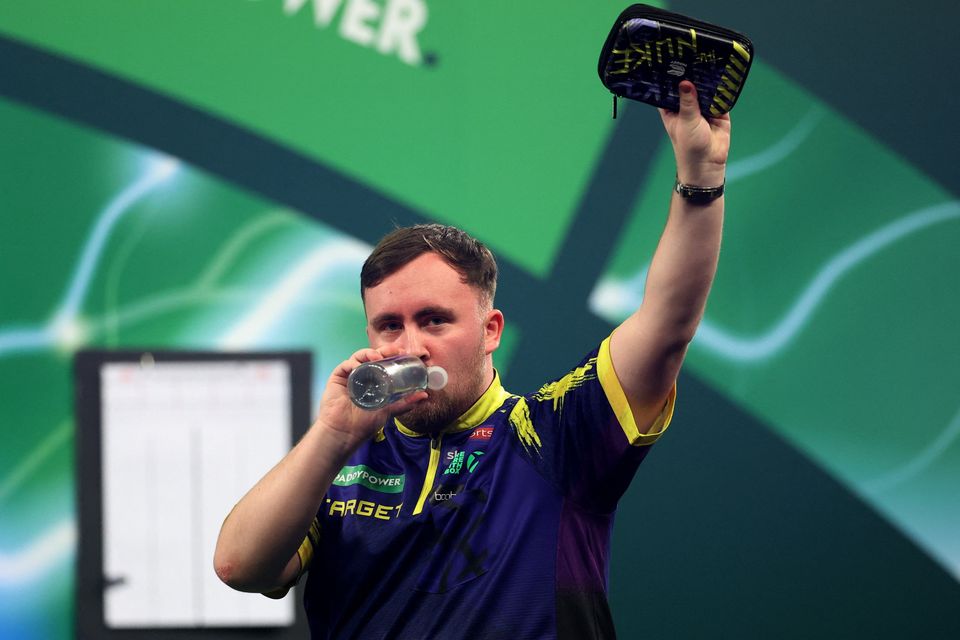 Luke Littler celebrates after winning his quarter final match against Krzysztof Ratajski. Photo: Reuters