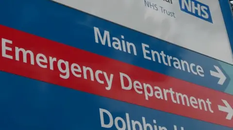 BBC An emergency department sign at a hospital