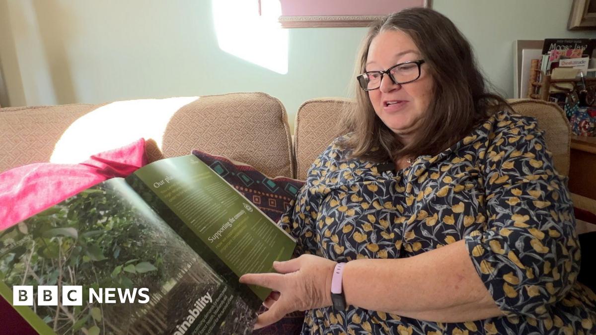 Jane Bertelli, a woman in her mid sixties, sits on the sofa in her home, looking through one of the brochures sent to her by Ethical Forestry Limited.