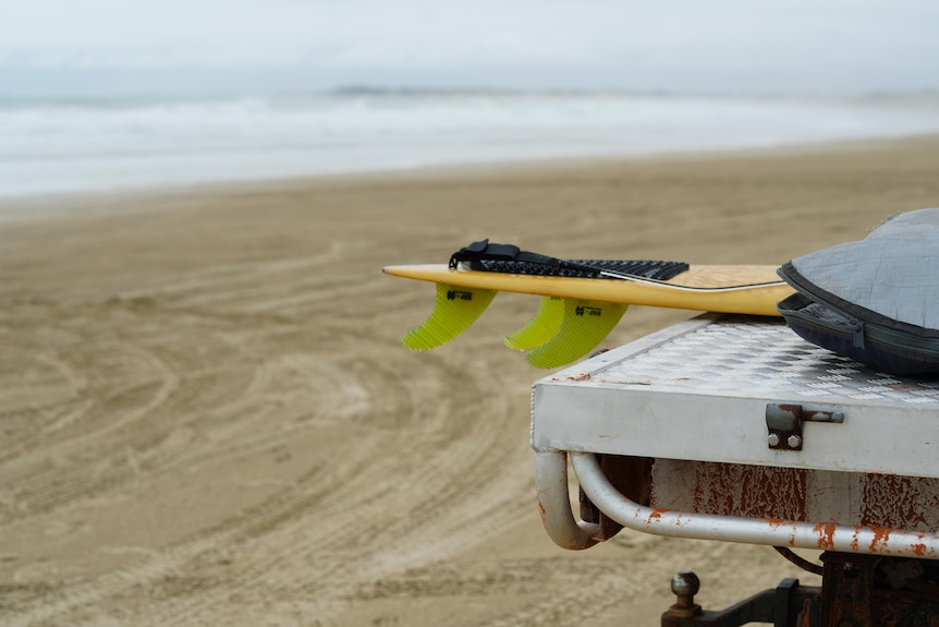a surfboard on a ute.