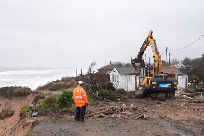 Properties being demolished close to the cliff edge at Hemsby in Norfolk