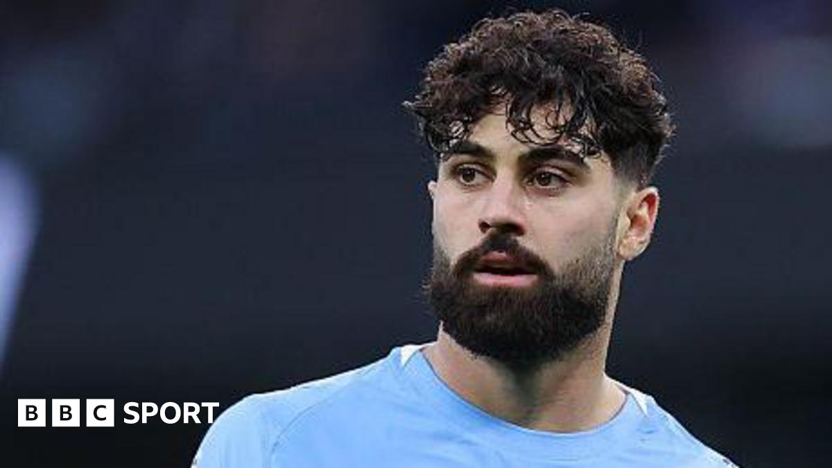 Luke Littler celebrates winning the 2026 PDC World Championship as tickertape falls