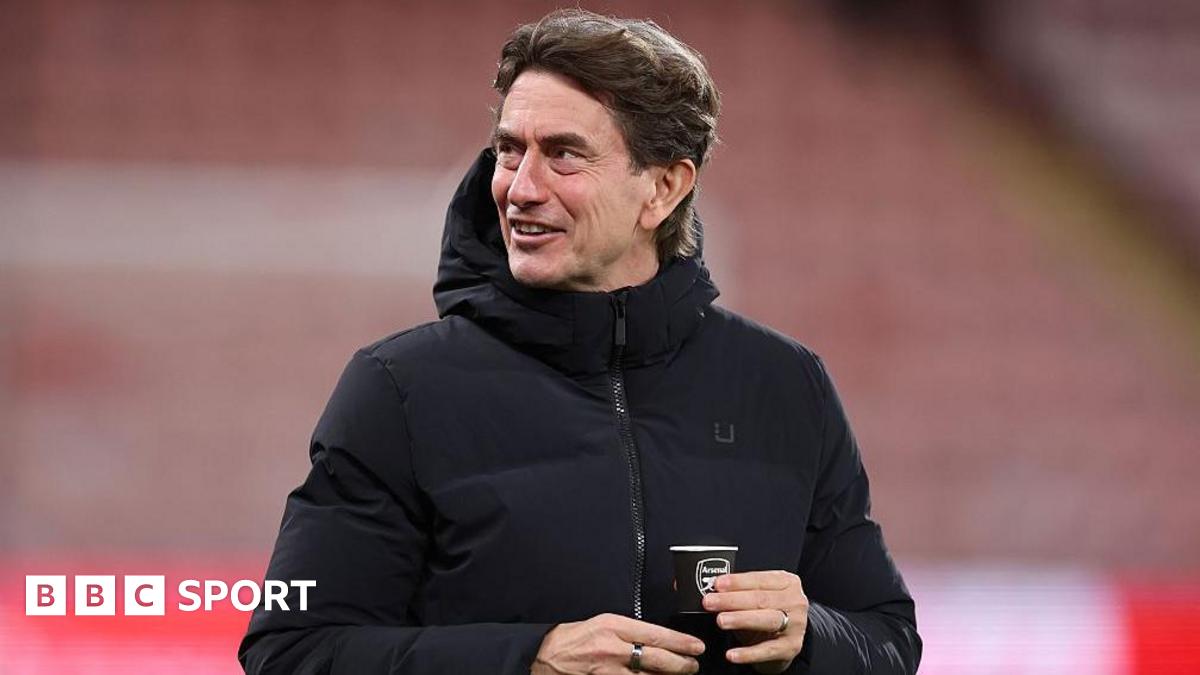 Spurs head coach Thomas Frank holds an Arsenal-branded cup before the loss at Bournemouth