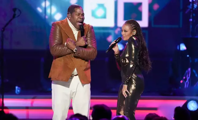 Busta Rhymes, left, and Chante Moore perform "I know what you want" during MusiCares Person of the Year honoring Mariah Carey on Friday, Jan. 30, 2026, in Los Angeles. (AP Photo/Chris Pizzello)