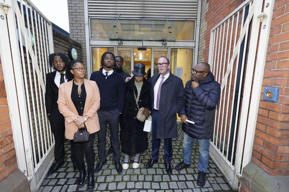 George Nkencho’s brother Emmanuel and mother Blessing with other family members before speaking to reporters after the jury returned a narrative verdict. Photo: Collins Courts