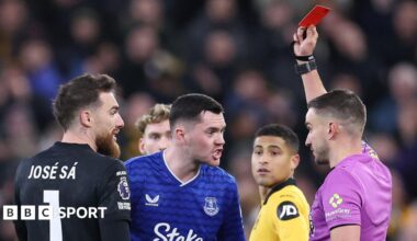 Michael Keane is shown a red card against Wolves