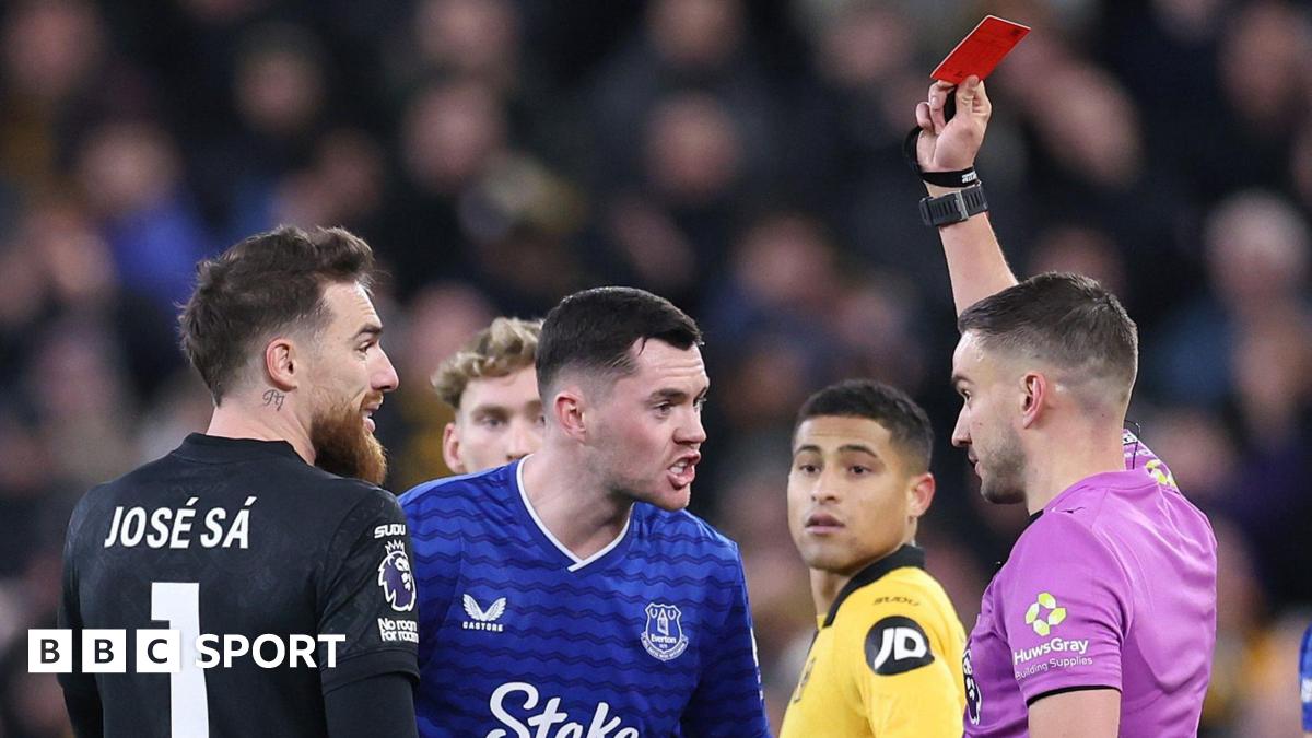 Michael Keane is shown a red card against Wolves