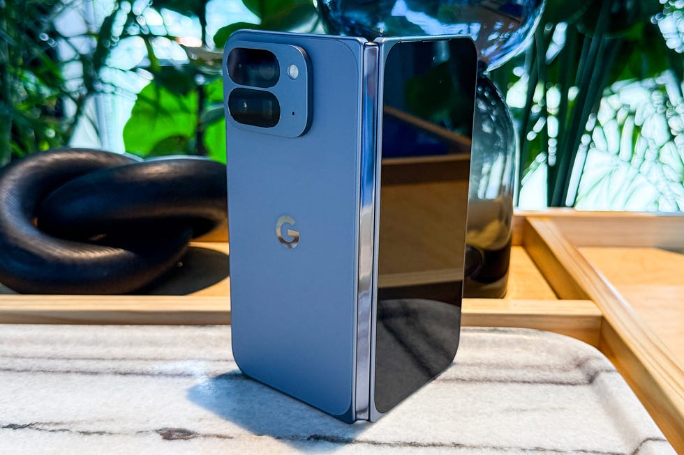 A smartphone with a sleek design, prominently displayed on a decorative tray. A smartphone with a sleek design, prominently displayed on a decorative tray.